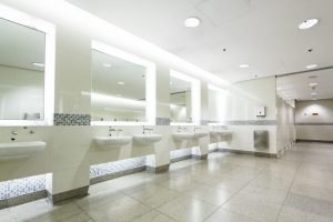 Commercial bathroom services, white with wall mirrors image
